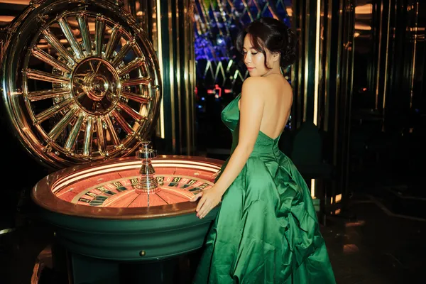 A close-up shot of golden coins falling around a spinning roulette wheel, representing immersive casino action at JILI7978.