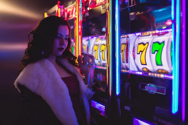 A player using their smartphone during a festive local event, representing JILI7978’s fully mobile-friendly casino.